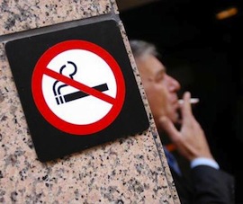 smoker-by-no-smoking-sign