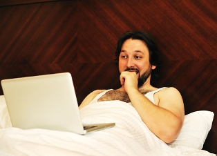 man porn bed laptop