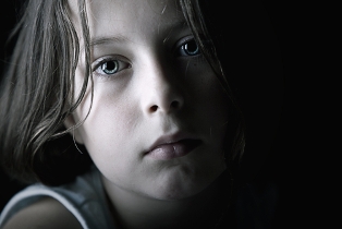 Researchers Link Child Abuse to Higher Risk of Relapse sad child