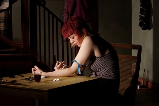 woman shooting heroin