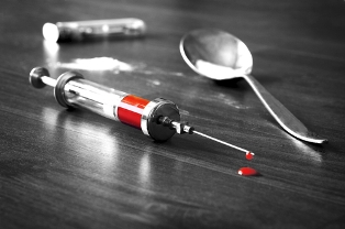 heroin needle concept blood