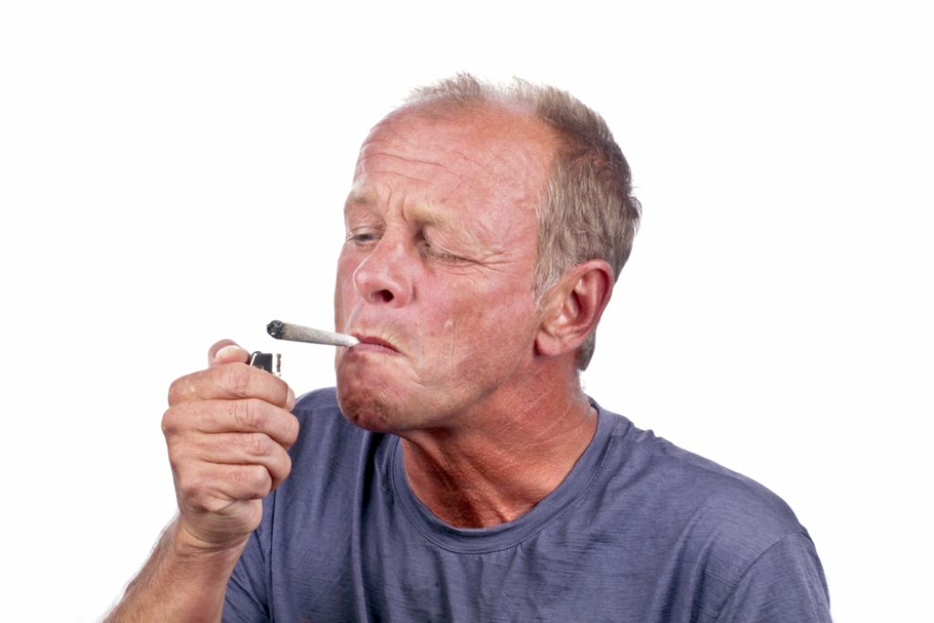 middle aged guy smoking weed