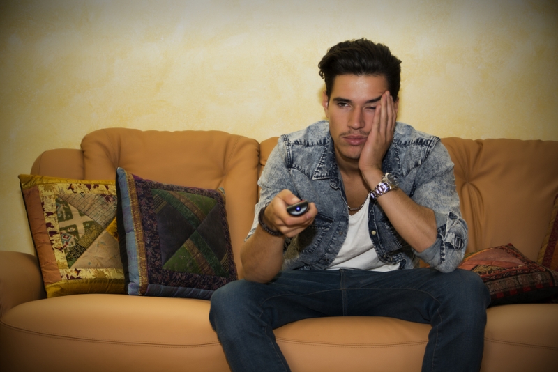 bored guy watching tv