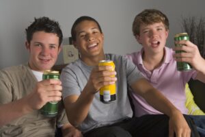 three teens drinking beer