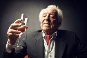 senior drinking champagn