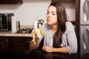 woman eating banana