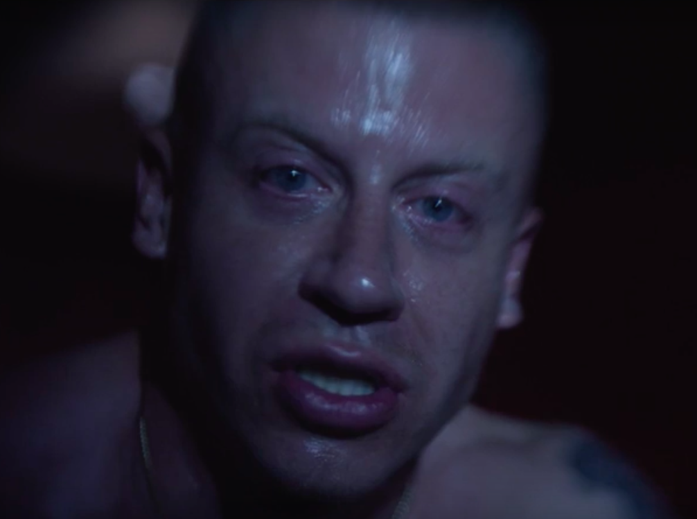 Macklemore Re-Enacts Opioid Comedown In 'Drug Dealer' Music Video