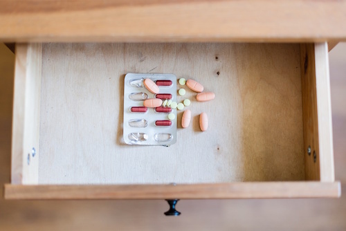 Pills in an open drawer.