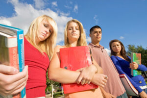 A group of teenagers standing.