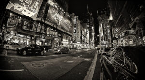 Black and white image of Times Square at night.