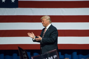 Donald Trump in front of an American flag
