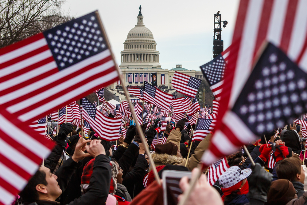 People waving flags near the White House on Inauguration Day.