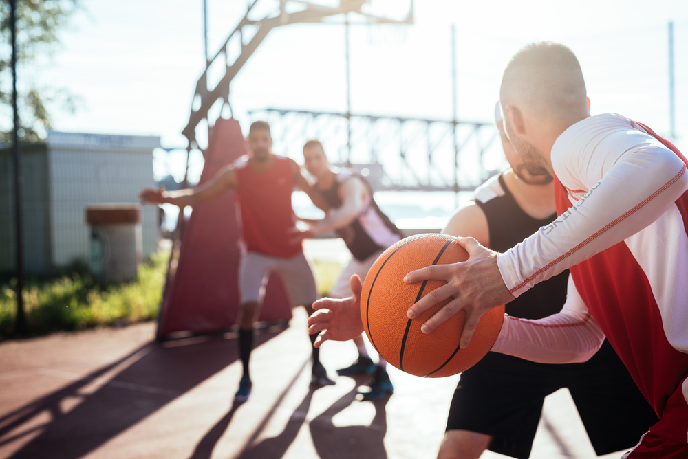 Men playing basketball