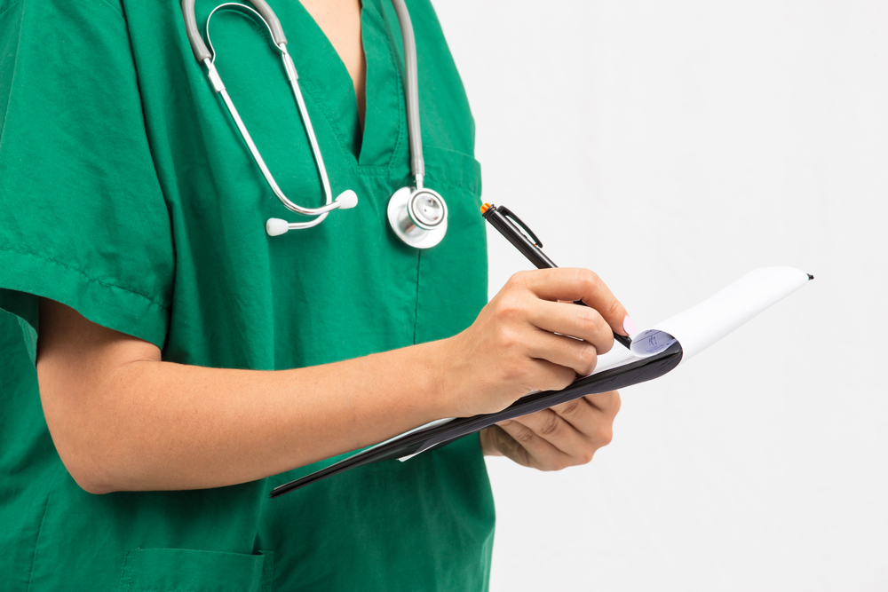 Doctor writing a prescription.