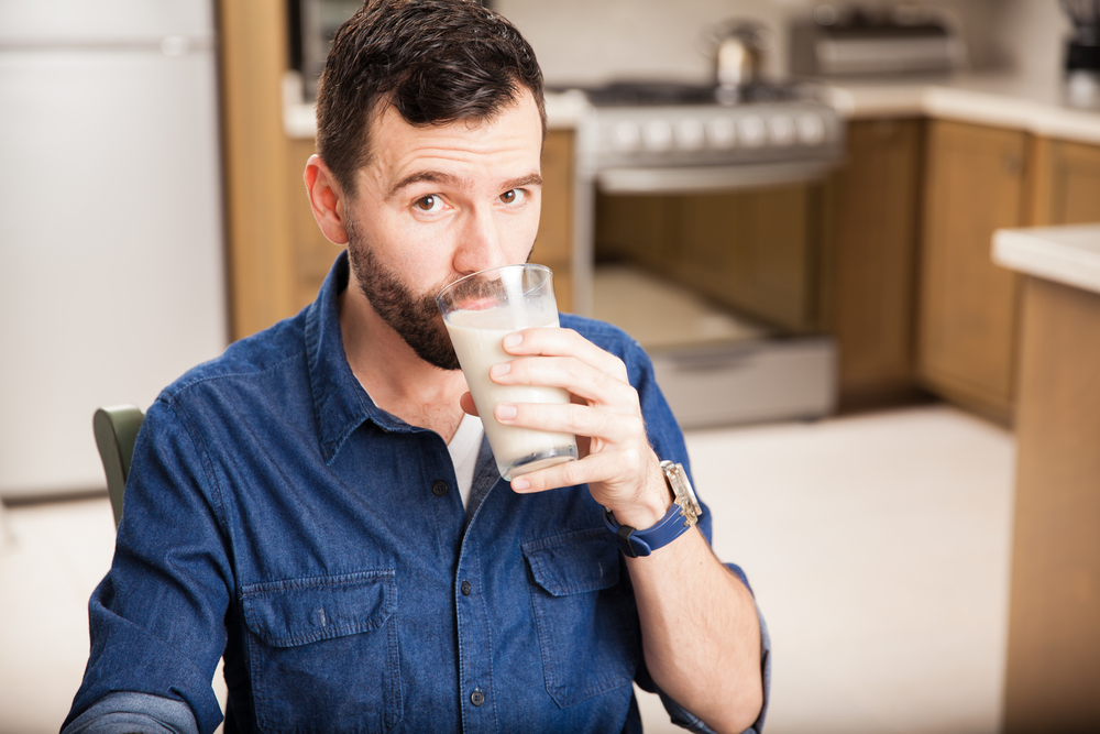 Man drinking milk.