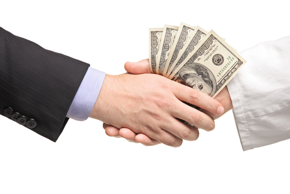 A handshake and exchange of money.