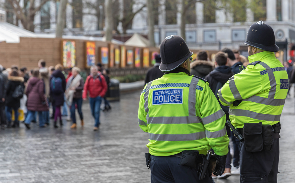 British police surveying a crowd.