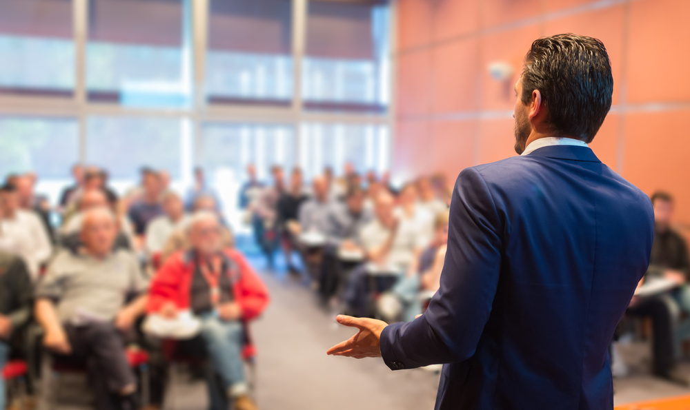 A man making a presentation to the public.