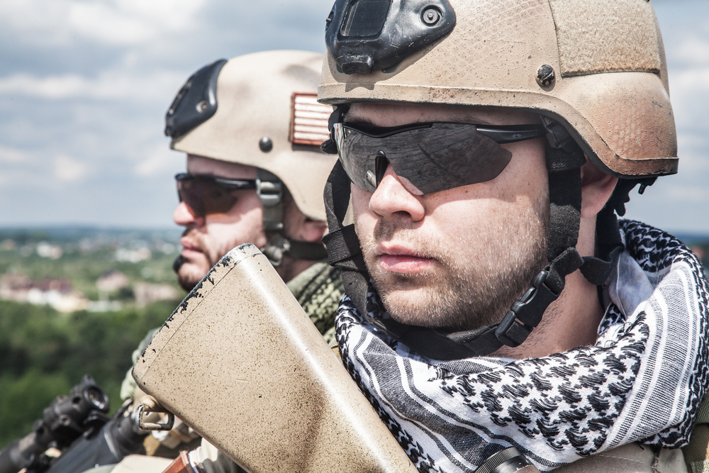 Navy SEALs surveying their surroundings