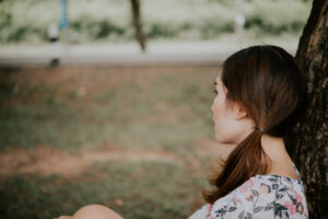 Girl looking away sadly
