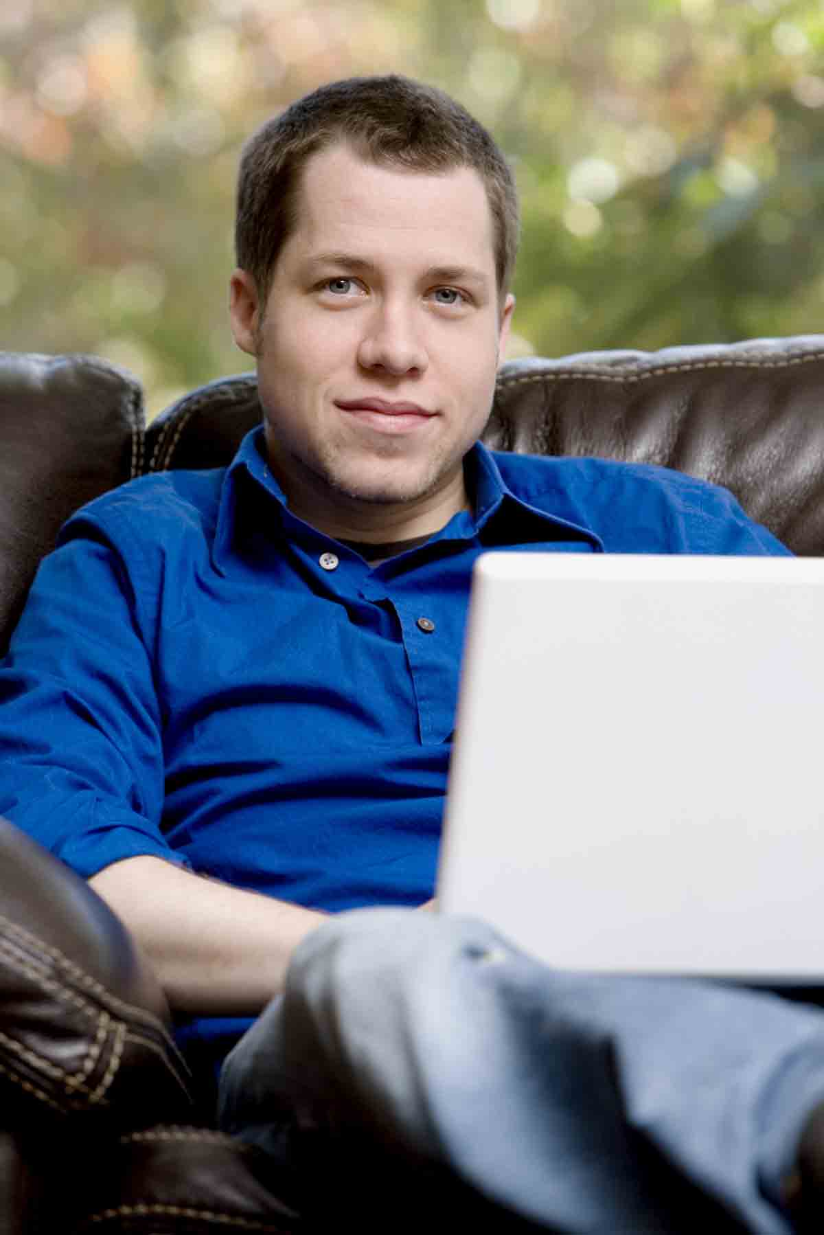 A man with a laptop computer