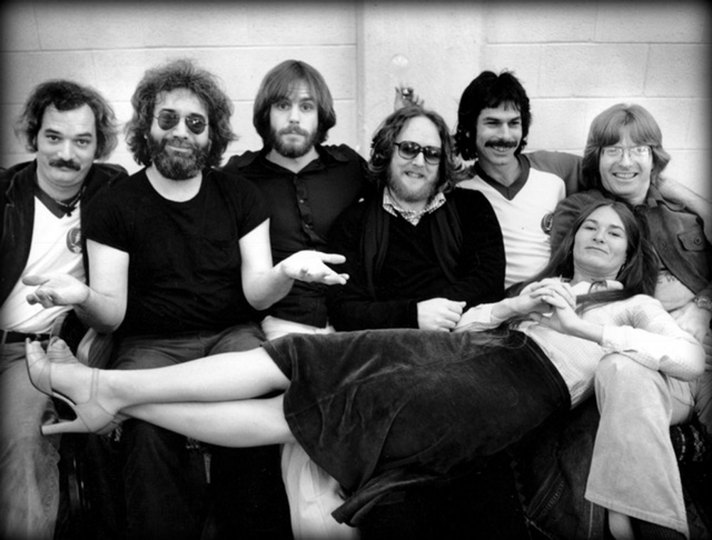 the band Grateful Dead holding up person