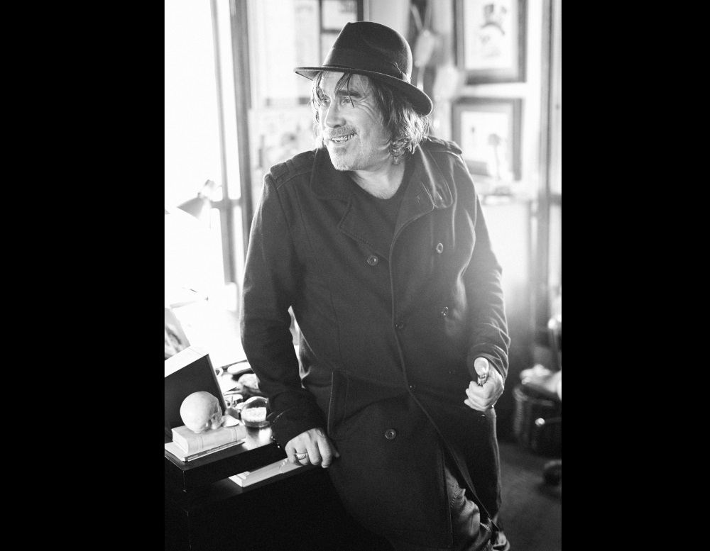 Jonathan Shaw standing wearing hat