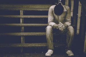 sad man sitting on steps