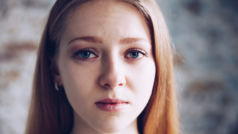 sad girl looking at camera