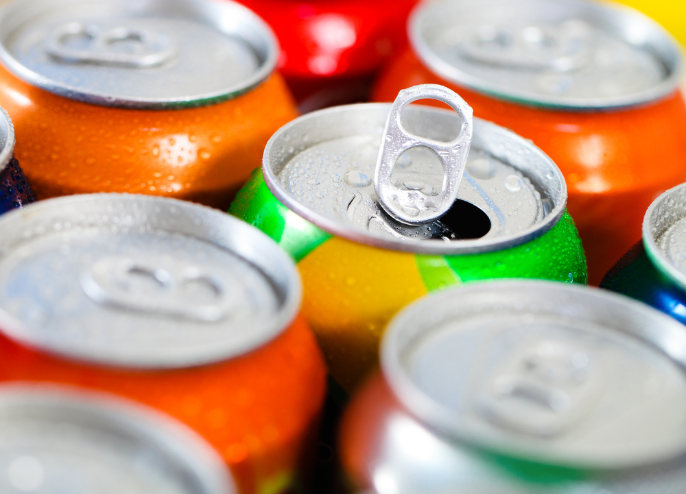 multiple colorful cans of soda