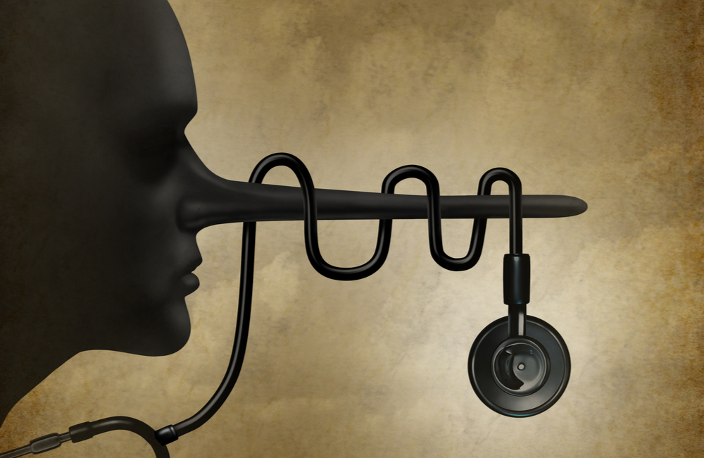 dishonest doctor health care symbol with and a stethoscope wrapped around the long liar nose