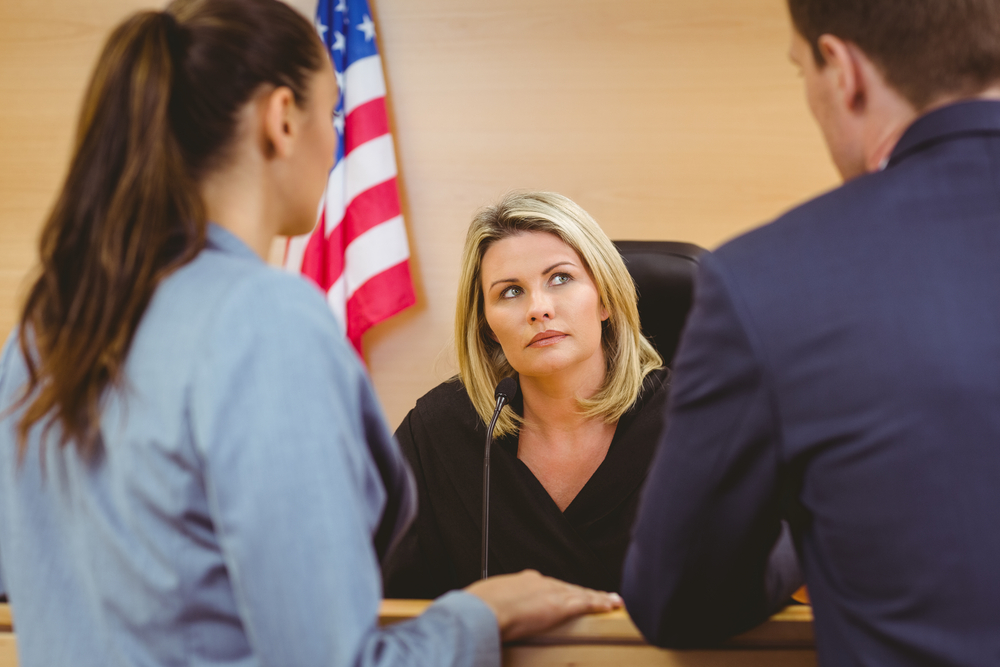Judge and lawyers speaking in the courtroom