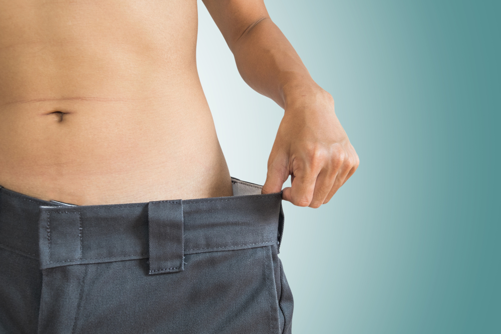 skinny man wearing over-sized pants