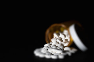 pills falling out of a prescription bottle