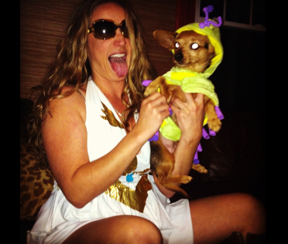 Rebecca Rush in She-Ra costume, holding a dog