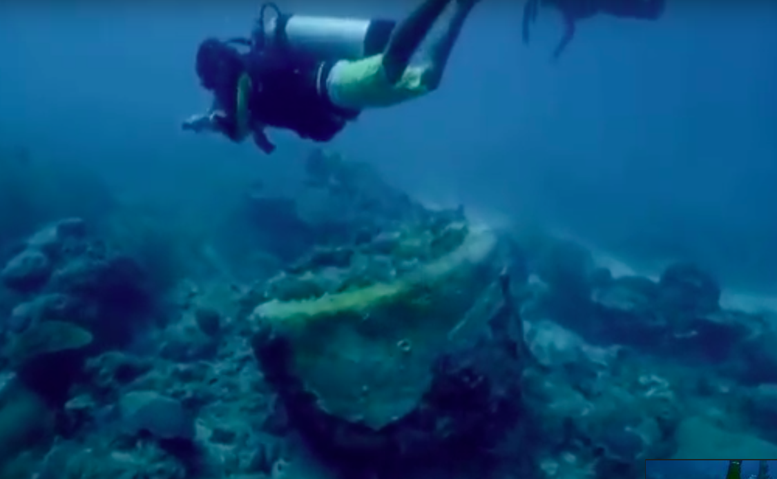 divers searching the water for the missing submarine