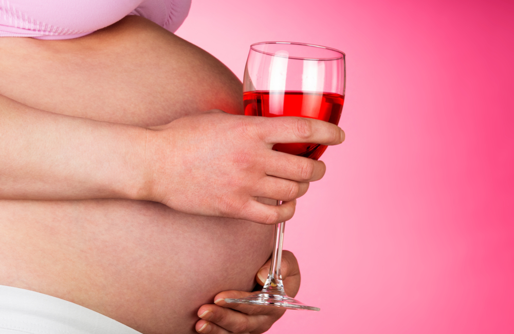 pregnant woman drinking wine