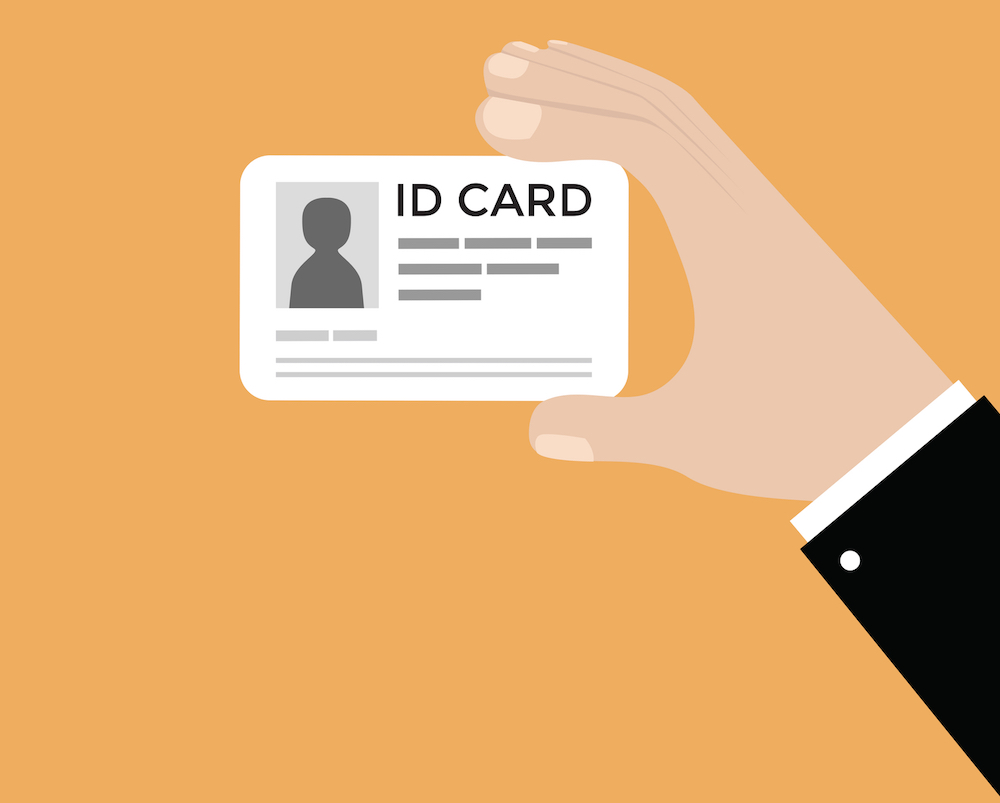 hand holding an id card