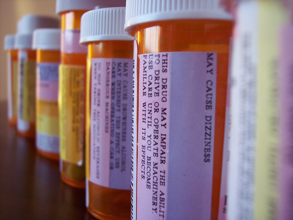 Pill bottle lineup with emphasis on warning labels