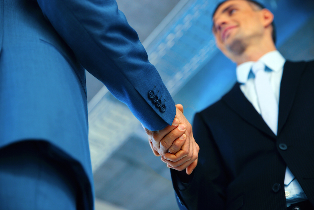 two businessmen shaking hands