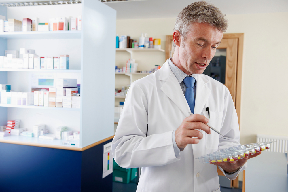 pharmacist counting pills