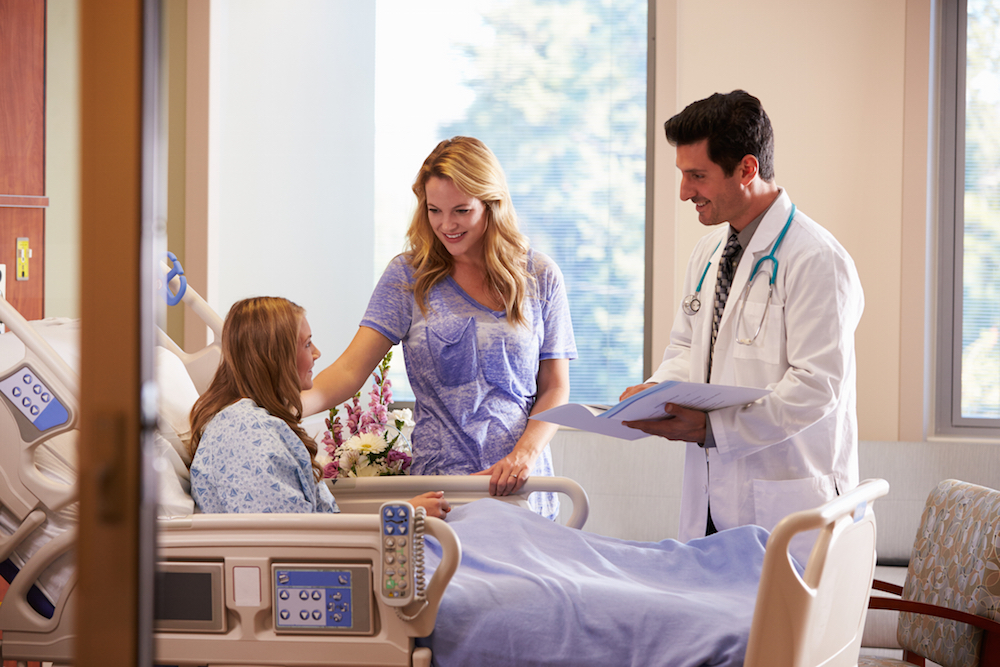 Doctor Talks To Mother With Teenage Daughter In Hospital