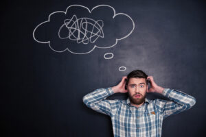 confused man with his hands on his head