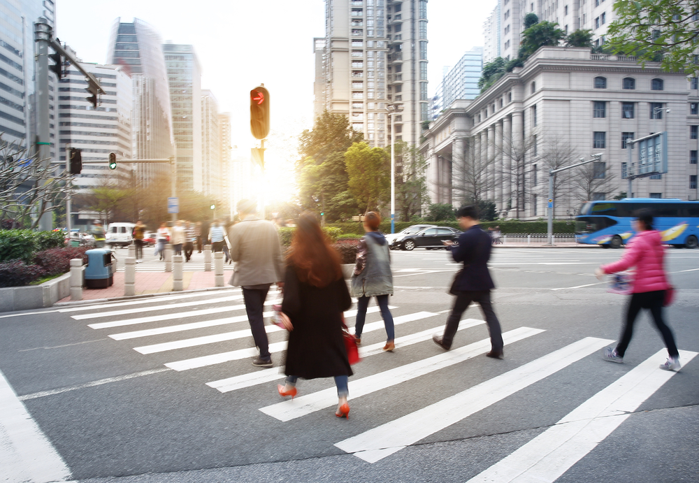 people using a busy cross walk
