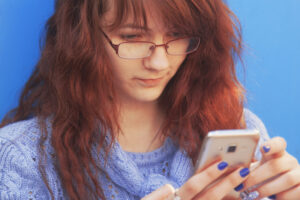 Young woman looking at her phone.