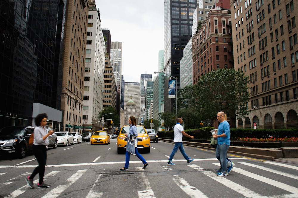 people crossing the street in NYC