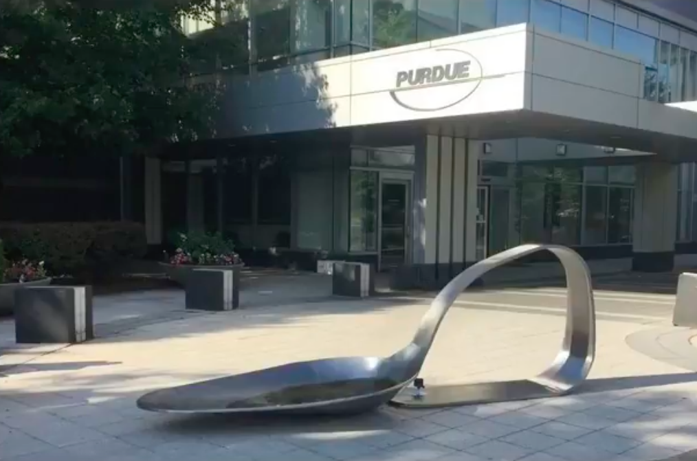 giant spoon sculpture in front of Purdue Pharma headquarters