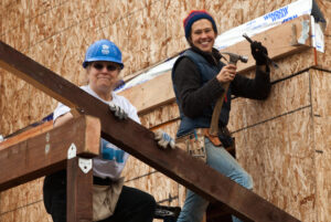volunteers building house