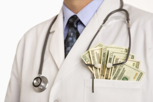 doctor with cash in his lab coat pocket.