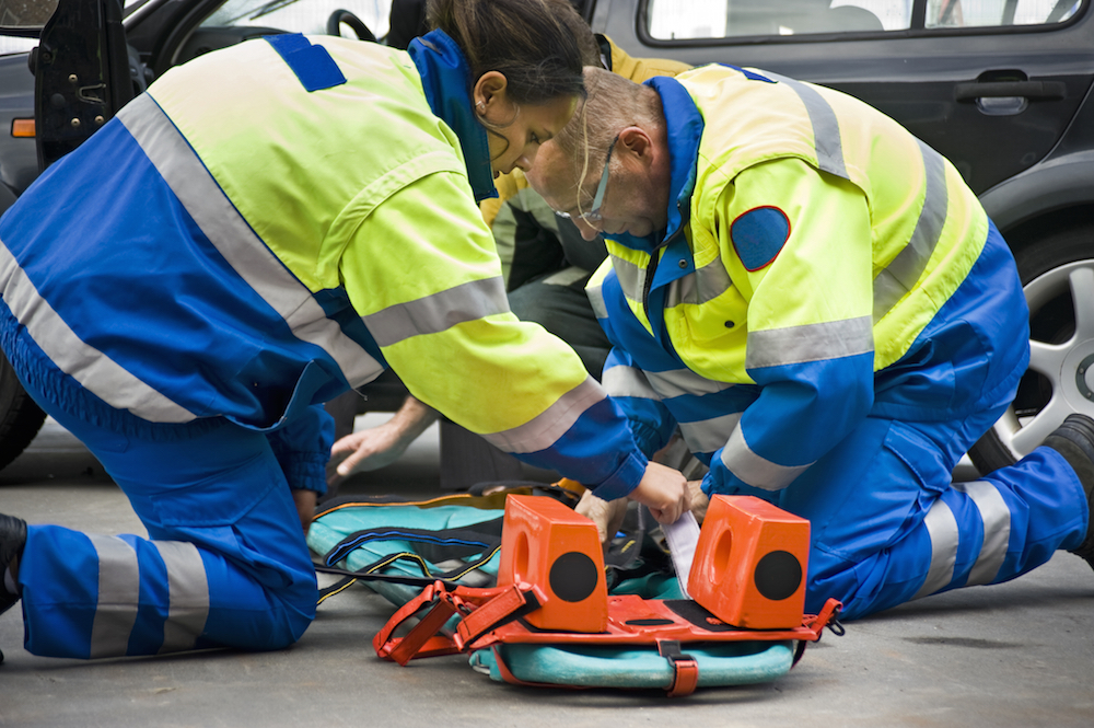 EMTs preparing a stretcher